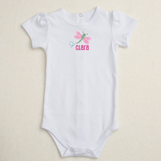 All cotton bodysuit with puff sleeves and a pinkdragonfly applique that can be personalized with embroidery