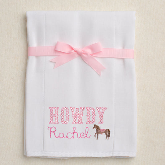white burp pad made from a cloth diaper with Howdy Rachel embroidered on it in addition to a mini horse embroidery.  Hand made personalized boutique baby gift
