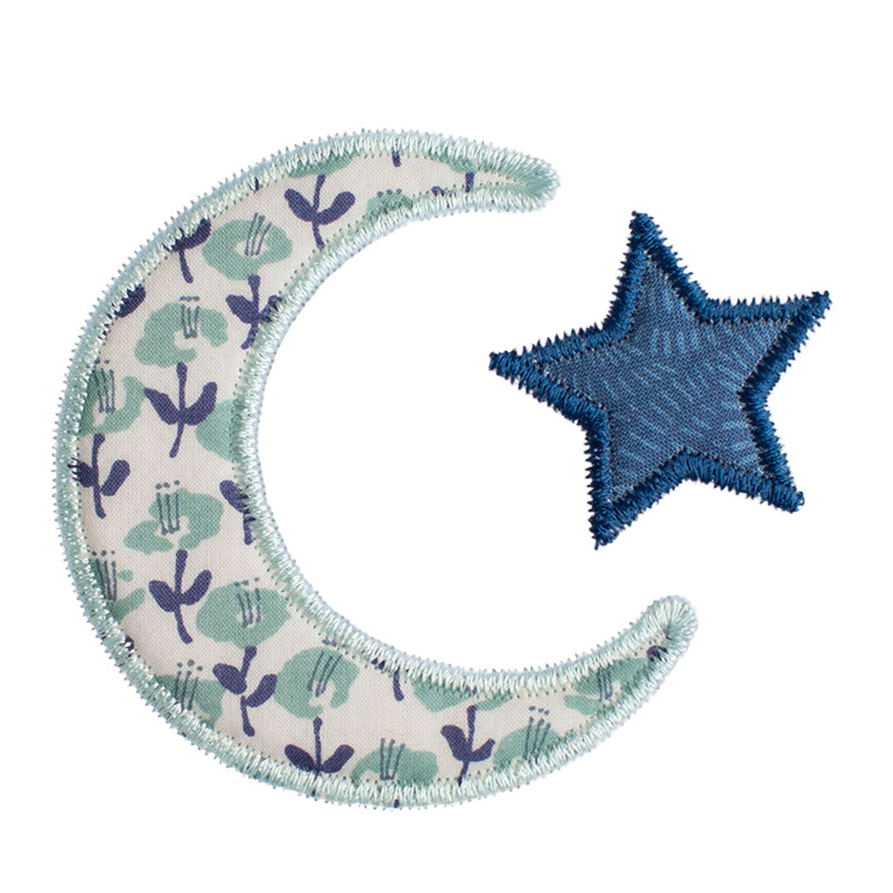 Close-up of Deacon Lane Bella Notte motif in seafoam/sage and navy featuring a floral reminiscent of a Liberty of London print.